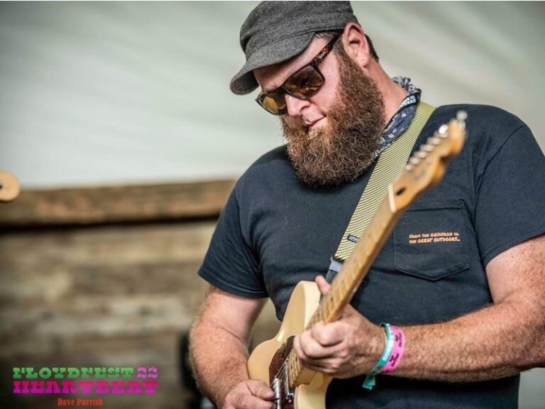 James playing guitar on stage at Floyd Fest 2022.