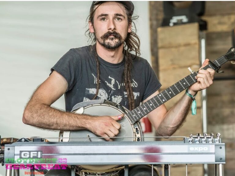 Justin playing banjo on stage at Floyd Fest 2022.