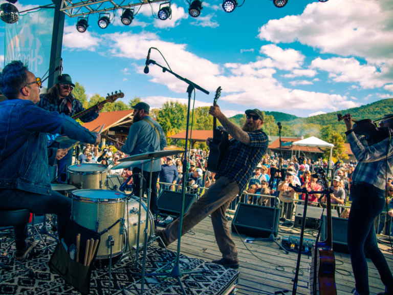 Low Water Bridge performing at Hoopla Fest with crowd in the background.