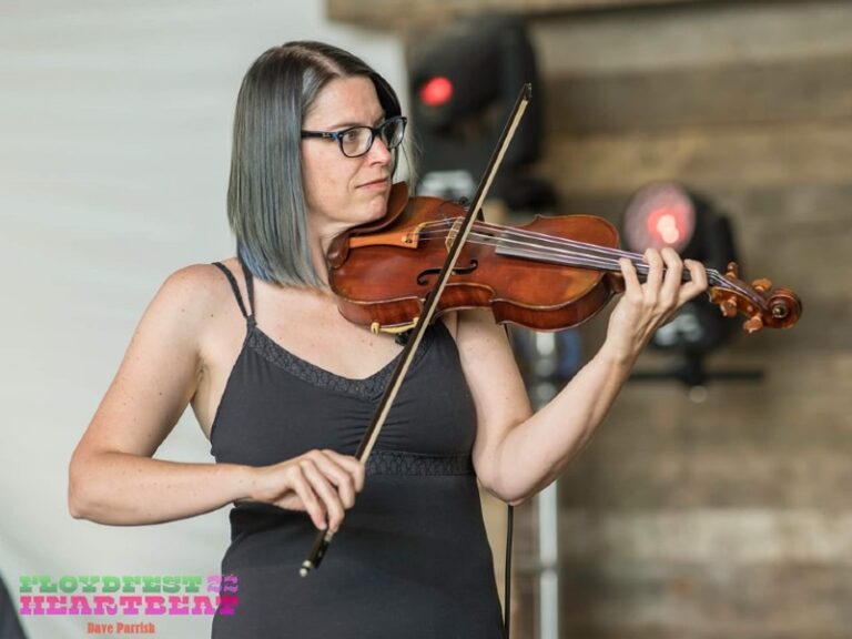 Stacey playing violin on stage at Floyd Fest 2022.